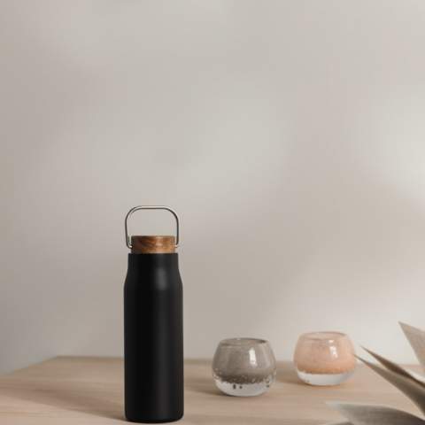 Ciro RCS recycled vacuum bottle is an elegant and functionally designed thermos bottle. The bottle has a lid of acacia wood with a metal loop, which makes the bottle easy to carry with you when you're on the go. Acacia wood is an organic material where variations in shade and color are natural characteristics. The vacuum construction with double walls in recycled stainless steel ensures that the bottle keeps the temperature intact for a long time, both hot and cold drinks. Certified by RCS (Recycled Claim Standard), RCS certification guarantees that the entire supply chain of the recycled materials is certified. The total recycled content is based on the overall product weight. This product contains 69% RCS-certified recycled stainless steel. The bottle is easy to clean and should only be cleaned by hand. Including FSC®-certified kraft packaging.<br /><br />HoursHot: 5<br />HoursCold: 15