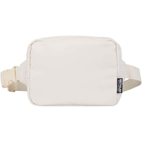 The Trip Aware™ recycled travel crossbody bag is a compact and functional bag designed for daily use and light travel. Made from durable 290D twill polyester with a knitted backing and lined with RPET 210D/PU, it features a clean, streamlined shape with practical storage options. The main zipped compartment holds your everyday essentials, while the back zipped pocket includes a ribbon for keys, as well as dedicated slots for pens and a passport. The adjustable strap with buckle ensures a secure and comfortable fit during movement. Each bag also comes with an Aware™ tracer. This innovative feature allows users to trace the origins and journey of their item through a QR code, enhancing transparency in the supply chain and fostering a stronger connection between the product and its production process. Volume capacity: 1 litre.