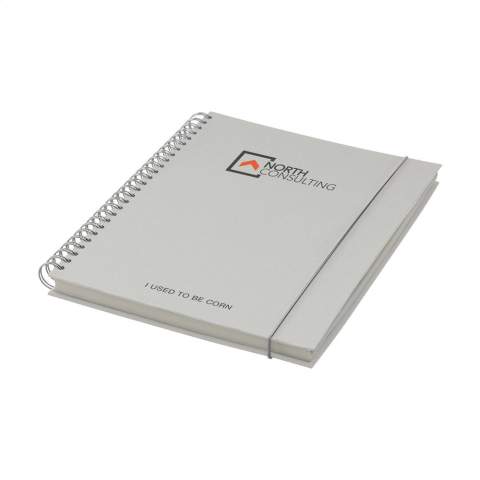 WoW! Bloc-notes au format A5. Avec environ 100 feuilles / 200 pages de papier ligné (80 g/m²), une solide reliure spirale métallique et un élastique de fermeture. La couverture rigide est composée à 15% de déchets agricoles et organiques tels que les tomates, les poivrons, les plantes et les oignons. Ces déchets sont mélangés avec du papier recyclé d'origine européenne. Un carnet pratique pour prendre des notes et noter des idées.