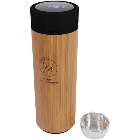 Double-walled vacuum insulated stainless steel and bamboo bottle with a temperature sensor on top of the lid, which displays the temperature of the drink inside the bottle (degrees Celsius). Keeps drinks hot for 8 hours or cold for 12 hours. Comes with a tea filter. Capacity: 500 ml. Delivered in a gift box. 