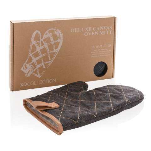 A handy companion in the kitchen, this quilted oven glove shields hands from hot objects. The separate thumb ensures a good grip, attached with decorative PU detail. Made with heavy quality 16oz. canvas. Supplied in a Kraft gift box. Machine wash at 30 degrees celsius with similar colours.