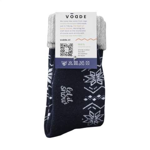Comfortable, woolen winter socks from Vodde. The socks feature a standard, knitted winter design. A logo can be knitted into the bottom of the sock in any colour of your choice. Ideal as home socks.  • The socks are supplied as standard in pairs with a label, which can be printed in your own full colour design.   • The socks are made from collected textiles and consist of 25% recycled wool, 55% RPET, 17% polyamide and 3% elastane. One size fits most. Wash at a maximum of 30 degrees. •  Minimum order in total: 100 pairs of socks.  • Optional: Supplied in pairs in a (customised) box made from recycled  cardboard - possible from 1,200 pairs of socks.  • By wearing these sustainable socks you are contributing to a world with less pollution. Developed and tested in the Netherlands. Made in the EU.