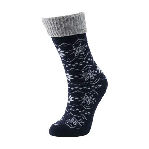 Comfortable, woolen winter socks from Vodde. The socks feature a standard, knitted winter design. A logo can be knitted into the bottom of the sock in any colour of your choice. Ideal as home socks.  • The socks are supplied as standard in pairs with a label, which can be printed in your own full colour design.   • The socks are made from collected textiles and consist of 25% recycled wool, 55% RPET, 17% polyamide and 3% elastane. One size fits most. Wash at a maximum of 30 degrees. •  Minimum order in total: 100 pairs of socks.  • Optional: Supplied in pairs in a (customised) box made from recycled  cardboard - possible from 1,200 pairs of socks.  • By wearing these sustainable socks you are contributing to a world with less pollution. Developed and tested in the Netherlands. Made in the EU.