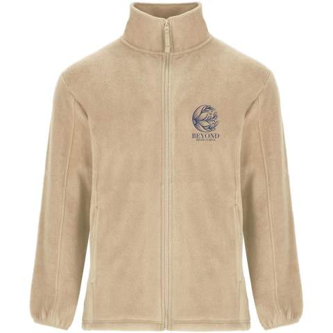Fleece jacket with high lined collar and matching reinforced covered seams. Injected zip with matching puller made of fabric. Side pockets. Cuffs with elastic trim. Bottom hem with inner side adjusters. Removable label. The model is 185 cm and is wearing size M.
