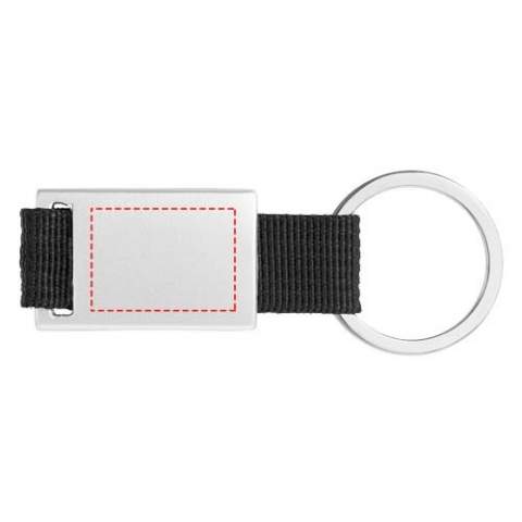 Porte-clés rectangulaire au look moderne. Aluminium et polyester de couleur. Sous boite cadeau noire.