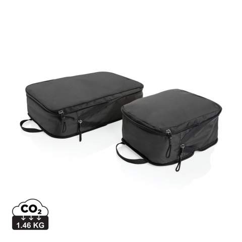A set of 2 packing cubes made with 100% RPET that can expand and compress to optimise packing space helping you pack more efficiently and stay organised. The small cube measures L25*W18*H10 cm with a volume of 4.5L. The large cube measures L36*W25*10 cm with a volume of 9L. Flat size 3cm and expanding up to 10cm. With AWARE™ tracer that validates the genuine use of recycled polyester.<br /><br />PVC free: true