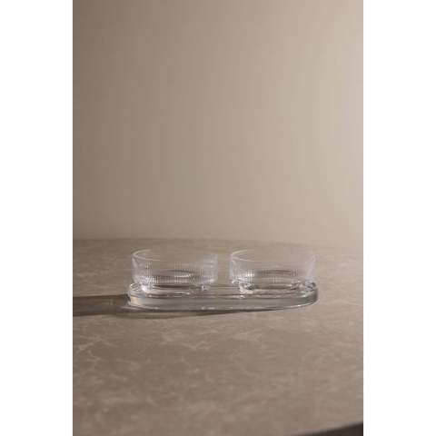 A tapas set with timeless design and classic, clean lines. Perfect for any occasion where you want to serve small dishes, snacks, or other sides with style and elegance. The set includes two bowls and a tray, which can be used together or separately. Made from soda-lime glass. The bowls hold 250 ml. Dishwasher safe.