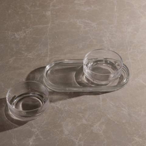 A tapas set with timeless design and classic, clean lines. Perfect for any occasion where you want to serve small dishes, snacks, or other sides with style and elegance. The set includes two bowls and a tray, which can be used together or separately. Made from soda-lime glass. The bowls hold 250 ml. Dishwasher safe.