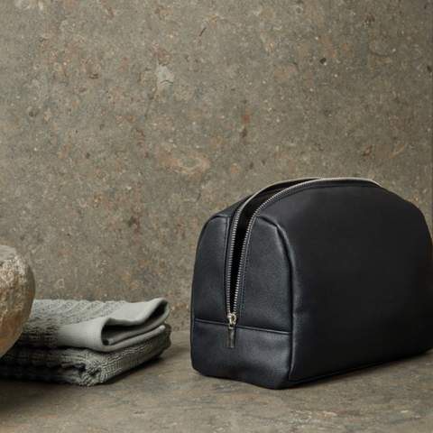 Effortlessly organise your travel essentials with our spacious toiletry bag. Designed with a clean and simple aesthetic, it's made from recycled PU and lining in accordance with RCS standards. The zipper along the short ends allows for easy access to the entire bag, making it convenient for on-the-go use. Certified by RCS (Recycled Claim Standard), RSC certification guarantees that the entire supply chain of the recycled materials is certified. The total recycled content is based on the overall product weight. This product contains 32% RCS-certified recycled polyester and 11% RCS-certified recycled PU
