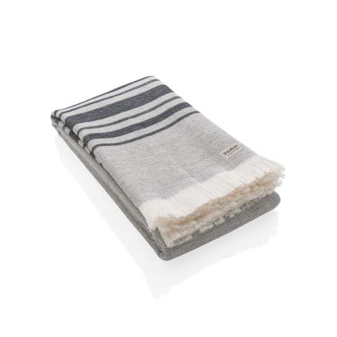 This lightweight, highly absorbent, sand-resistant, and quick dry towel is one of the best sustainable towels out there. Hammam towels are multifunctional: you can also use it as a picnic, baby blanket or as a yoga, beach, and gym towel. Even as a table cloth. Best of all, the thin material makes it ultra-portable and easy to toss in your beach bag, suitcase or over your shoulder. This towel contains 12% recycled cotton and is super soft and silky to the touch. With AWARE™ tracer that validates the genuine use of recycled cotton.  Each towel saves 597,8 litres of water. 2% of proceeds of each Impact product sold will be donated to Water.org. Made in Portugal. OEKO-TEX® STANDARD 100. 2306129 Centexbel.