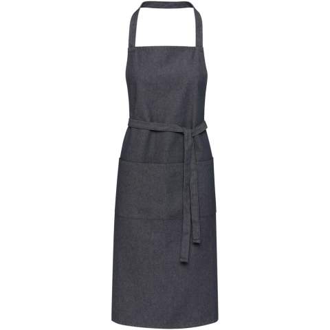 The Nima apron is made of 320 g/m² 70% recycled cotton and 30% recycled polyester making it thick and sturdy, and comfortable to wear. It features 2 adjacent pockets (each 22 x 20 cm), and a 1 metre tie-back closure. This apron also comes with an Aware™ tracer. This innovative feature allows users to trace the origins and journey of their item through a QR code, enhancing transparency in the supply chain and fostering a stronger connection between the product and its production process.
