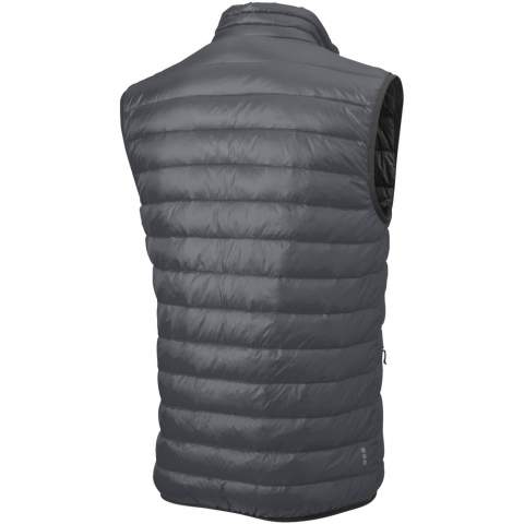 The Fairview men's lightweight down bodywarmer – perfect functionality to elevate your outdoor attire. This bodywarmer features elasticated binding on the bottom, offering a comfortable and slightly tight fit that adds protection against chilly winds. The outer shell fabric is made of nylon dull cire 20D woven with a water-repellent finish, ensuring exceptional durability and good protection against the elements. The lightweight material allows for easy movement and effortless wear throughout the day. The downproof pressed fabric prevents the down and feathers from escaping, ensuring long-lasting warmth and an extra level of durability. The down insulation is RDS certified (Responsible Down Standard), consisting of down and feathers, providing lightweight warmth without compromising ethical standards. A reliable companion for any outdoor adventure.