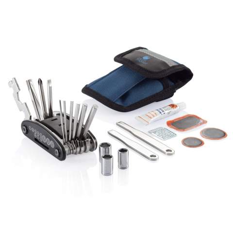 Blue pouch with reflective line on top, including 15 functions multitool with slotted screwdriver, cross-head screwdriver, nut driver, hex keys: 2mm, 2,5mm, 3mm, 4mm, 5mm, 6mm, wrenches: 8mm, 10mm, 15mm, spoke wrench: 14GE, sockets: 8mm, 9mm, 10mm, set with black plastic rack, 2 nickel plated tyre levers, tube glue, grinder and 3 rubber patches.