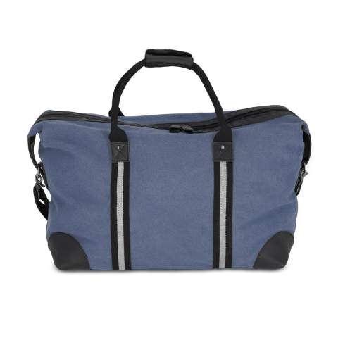 Stylish weekend bag made from recycled cotton canvas. Features 100% recycled reflective webbing, luxurious zips and pulls, and 100% recycled polyester lining. Includes an adjustable removable shoulder strap, 1  front pocket, and 2 interior pockets, one with a zip.