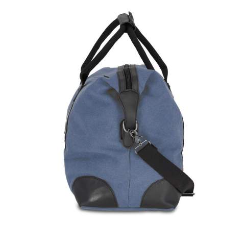 Stylish weekend bag made from recycled cotton canvas. Features 100% recycled reflective webbing, luxurious zips and pulls, and 100% recycled polyester lining. Includes an adjustable removable shoulder strap, 1  front pocket, and 2 interior pockets, one with a zip.