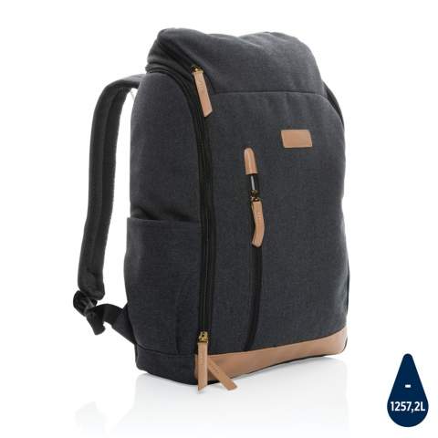This clean 16oz. recycled canvas laptop backpack accompanies you on every commute through the professional landscape. With deep vertical front pocket and a neat easy wide open zipper that reveals a roomy interior complete with a 15 inch laptop compartment. Each laptop backpack saves 1257.2 litres of water. 2% of proceeds of each Impact product sold will be donated to Water.org. Composition 60% recycled cotton and 40% recycled polyester. Lining in 150D recycled polyester.