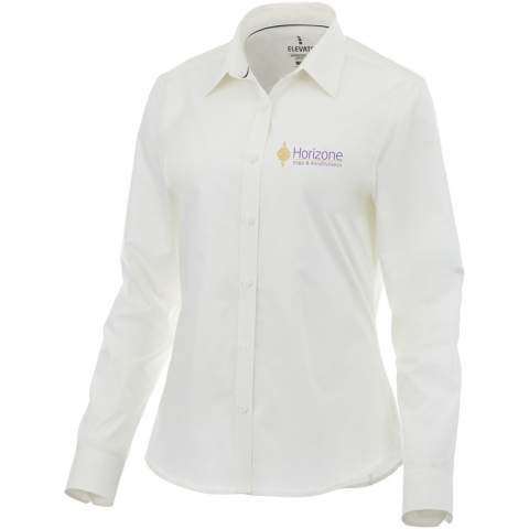 The Hamell long sleeve women's stretch shirt – an ideal combination of style and comfort. This woven shirt features a lightweight poplin fabric of 97% cotton and 3% elastane. Poplin fabric is known for its tight weave, which provides exceptional durability while maintaining a soft and smooth texture against the skin. This means that the Hamell shirt is not only comfortable to wear but also resistant to everyday wear and tear, ensuring long-lasting use. The added stretch provides ultimate freedom of movement, ensuring optimal comfort throughout the day even more. Its hidden button-down collar adds sophistication while maintaining a clean look. This shirt is designed with a fitted shape for a feminine look.