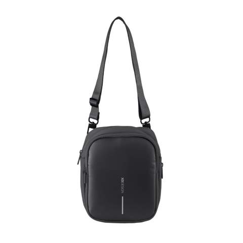 The Boxy Sling is a versatile cross body bag, designed to carry everyday essentials. The pack can be worn around the neck, over the shoulder or around the waist. It has enough capacity to hold a cellphone, wallet or purse, passport, notebook and various other small items. The hidden rear pocket is perfect for discreetly storing cash, cards or other valuable items. The Boxy Sling has a unique hidden water bottle pocket that can stay tucked away when not in use. Made from R-pet fabric with the AWARE™ tracer. With AWARE™, the use of genuine recycled fabric is guaranteed. 27% recycled content.<br /><br />PVC free: true