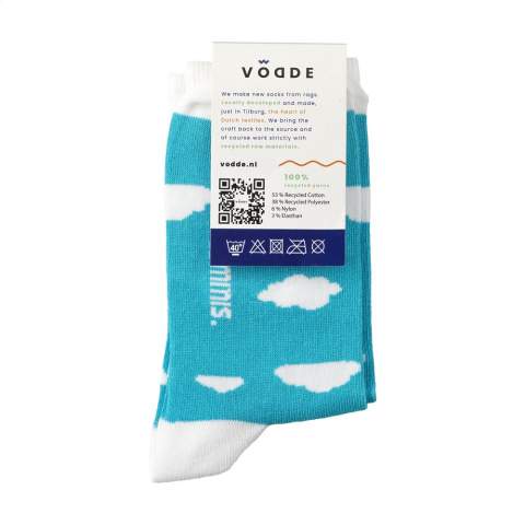 Comfortable socks from Vodde made using a 100% circular economy manufacturing process. These socks are made from collected textiles. The socks consist of 53% recycled cotton (from collected pieces of fabric), 38% recycled polyester (from collected PET bottles), 6% nylon and 3% elastane. Including knitted-in, customised design. All Vodde socks are supplied as standard in pairs with a label, which can be printed in your own full colour design. This way you can design your own socks that perfectly match any corporate identity. These thin quality socks, designed for everyday use, are perfect to combine with a casual outfit.   • Available in sizes M (36-40) and L (41-46). • Minimum order: 100 pairs of socks per size. Minimum order in total: 200 pairs of socks.  • Optional: Supplied in pairs in a (customised) box made from recycled  cardboard - possible from 1,200 pairs of socks.   • By wearing these socks you are contributing to a sustainable world with less pollution. Developed and tested in the Netherlands. Made in the EU.   • The base of the socks is made of recycled yarn and comes in a standard colour. You can choose from 21 standard colours of recycled yarn. Any pattern in the base, cuff, heel and toe can be realised in any colour of your choice.   • The Dutch company Vodde reuses discarded textiles to make new products designed by Dutch designers. Vodde makes its yarn from cotton collected by local 'rag farmers' and from cutting waste from textile production in European countries where Vodde makes its own products. In addition, polyesters derived from PET bottles, nylon, fishing nets and other collected waste are also used.