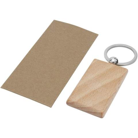 Porte-clés rectangulaire en bois de hêtre, livré dans une enveloppe en papier recyclé kraft brun. Les dimensions du porte-clés sont de 5,5 x 3,5 cm. Peut être gravé. 