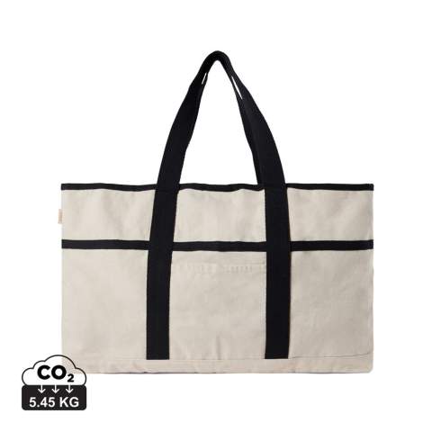 Hit the beach in style with this generous beach bag. Its spacious design, complemented by a towel holder at one side, makes it perfect for beach outings or picnics. The interior features a pocket to keep your valuables safe and secure. Crafted from 500 gsm recycled canvas. The canvas remains undyed and unbleached, eliminating any environmental impact from chemicals. Crafted from 100% recycled material, this bag reinforces our dedication to responsible sourcing. It also features the AWARE™ tracer technology, validating the genuine use of recycled materials. 2% of the proceeds of each product sold will be donated to Water.org.