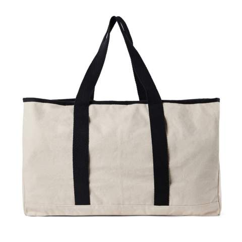 Hit the beach in style with this generous beach bag. Its spacious design, complemented by a towel holder at one side, makes it perfect for beach outings or picnics. The interior features a pocket to keep your valuables safe and secure. Crafted from 500 gsm recycled canvas. The canvas remains undyed and unbleached, eliminating any environmental impact from chemicals. Crafted from 100% recycled material, this bag reinforces our dedication to responsible sourcing. It also features the AWARE™ tracer technology, validating the genuine use of recycled materials. 2% of the proceeds of each product sold will be donated to Water.org.