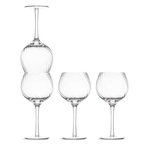 These four Opacity Wine Glasses are made of clear glass and have a beautiful spun glass pattern. They are thin and clear wine glasses with a perfect contrast between luxury and quirkiness. Design by Studio Byon. Delivered in a gift box.

