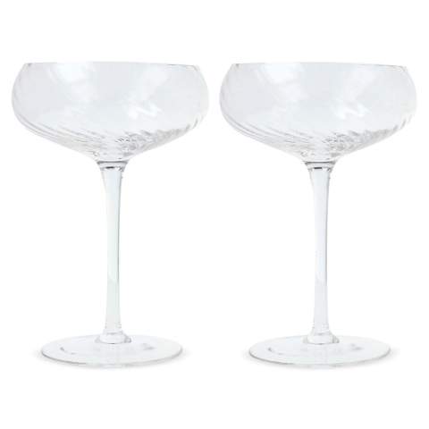 These luxurious Opacity Champagne coupes are made of clear glass with a beautiful spun glass pattern. The coupes are also perfect to use for desserts or liqueur. Using the coupes, guarantees a more festive feeling. A design reflects the contrast between luxury and quirkiness. Design by Studio Byon. Supplied as a set in Giftbox.

