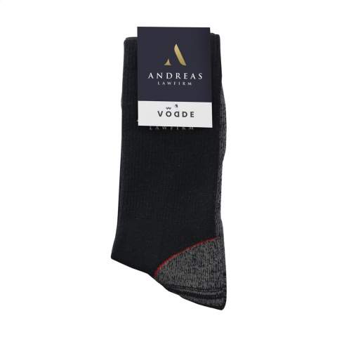Comfortable, sustainable work socks from Vodde, made from recycled textiles. These socks have a soft, pleasant rib structure with reinforced heel, toe and foot. This provides extra abrasion resistance and durability when worn in work boots. Arch support prevents blisters and provides extra comfort with the terry cloth sole.  • The socks are supplied as standard in pairs with a label, which can be printed in your own full colour design.  • These socks are made from collected textiles and consist of 43% recycled cotton, 38% recycled polyester, 10% polyamide, 10% recycled polyamide and 2% elastane.   • Available in sizes M (36-40) and L (41-46). • Minimum order: 100 pairs of socks per size. Minimun order in total: 100 pair of socks.  • Optional: Supplied in pairs in a (customised) box made from recycled  cardboard - possible from 1,200 pairs of socks.   • By wearing these socks you are contributing to a sustainable world with less pollution. Developed and tested in the Netherlands. Made in the EU.