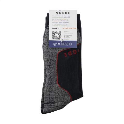 Comfortable, sustainable work socks from Vodde, made from recycled textiles. These socks have a soft, pleasant rib structure with reinforced heel, toe and foot. This provides extra abrasion resistance and durability when worn in work boots. Arch support prevents blisters and provides extra comfort with the terry cloth sole.  • The socks are supplied as standard in pairs with a label, which can be printed in your own full colour design.  • These socks are made from collected textiles and consist of 43% recycled cotton, 38% recycled polyester, 10% polyamide, 10% recycled polyamide and 2% elastane.   • Available in sizes M (36-40) and L (41-46). • Minimum order: 100 pairs of socks per size. Minimun order in total: 100 pair of socks.  • Optional: Supplied in pairs in a (customised) box made from recycled  cardboard - possible from 1,200 pairs of socks.   • By wearing these socks you are contributing to a sustainable world with less pollution. Developed and tested in the Netherlands. Made in the EU.