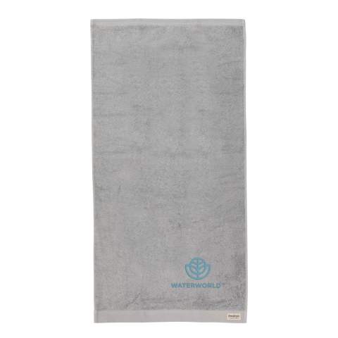 These spa-quality sustainable bath towels of 500 grams are delightfully thick, silky, and super soft to your skin. The luxurious Ukiyo towels are ultra-soft, quick-drying, and offer great absorbency.  This towel contains 30% recycled cotton and is super soft and silky to the touch. With AWARE™ tracer that validates the genuine use of recycled cotton. 2% of proceeds of each Impact product sold will be donated to Water.org. Machine washable. Made in Portugal.