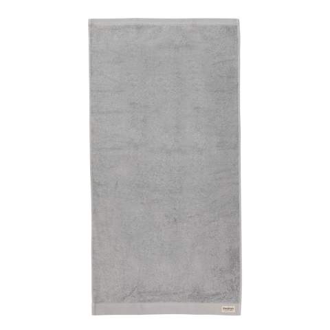 These spa-quality sustainable bath towels of 500 grams are delightfully thick, silky, and super soft to your skin. The luxurious Ukiyo towels are ultra-soft, quick-drying, and offer great absorbency.  This towel contains 30% recycled cotton and is super soft and silky to the touch. With AWARE™ tracer that validates the genuine use of recycled cotton. 2% of proceeds of each Impact product sold will be donated to Water.org. Machine washable. Made in Portugal.