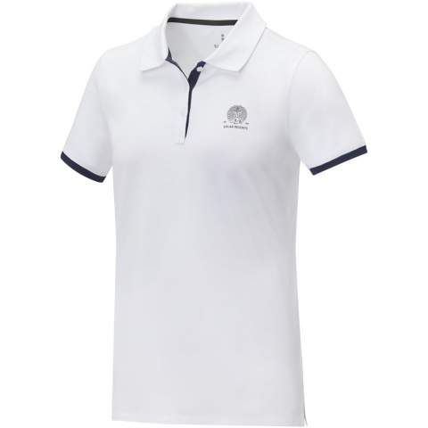 The Morgan short sleeve women's duotone polo is a stylish and comfortable option for any casual or business setting. Made from a 200 g/m² piqué knit cotton fabric, this polo is both durable and breathable. Featuring a flat knit collar and rib cuffs with contrast colour detailing, this polo offers a modern twist on a classic design. The two-button placket and pick-stitch details add an extra touch of sophistication, and the satin neck tape and heat transfer main label provide comfort and ease of wear. This polo is designed with a fitted shape for a feminine look.