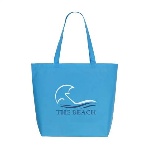 Large, non-woven shopping and beach bag (80 g/m²) with long handles. Broad model. Strong and light.