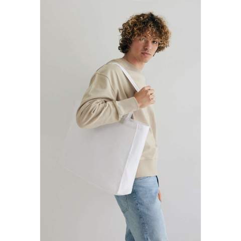 Tell a true story about sustainability and wear it with pride! Carry all your essentials in this functional recycled 145 gsm cotton tote bag. The tote bag features a 14cm gusset for extra storage and is embedded with AWARE™ tracer technology. With AWARE™, the use of genuine recycled fabric materials (70% rcotton/30% rpet) and water reduction impact claims are guaranteed. Save water and use genuine recycled fabrics. If you choose this item you save 860 litres of water. With the focus on water, 2% of proceeds of each Impact product sold will be donated to Water.org. Water savings are based on figures when compared to conventional fibre. This calculated indication is based on reliable LCA data as published by Textile Exchange in their Material Snapshots 2016.<br /><br />PVC free: true