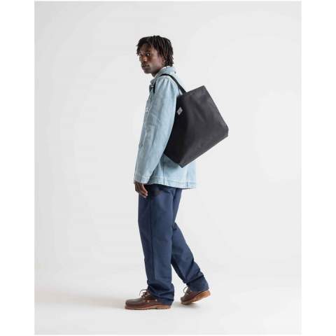 Simple design, recycled materials — this utilitarian hero is your do-it-all tote bag. The bag is crafted from EcoSystem™ 600D fabric and liner, both made from 100% recycled post-consumer water bottles. The tote bag has a metal snap closure and smooth webbing top-carrying handles for ultimate comfort. 