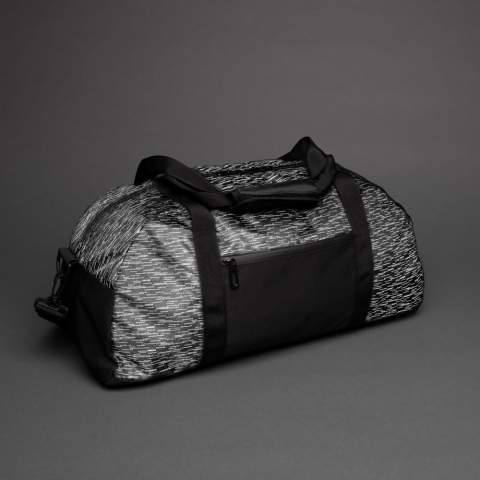 Increase your visibility in style with this weekend duffel made with 100% recycled polyester and AWARE™ tracer. With AWARE™, the use of genuine recycled fabric materials and water reduction impact claims are guaranteed, by using the AWARE disruptive physical tracer and blockchain technology. Save water and use genuine recycled fabrics. The weekend duffel backpack features a modern allover reflective print and a front zipper pocket. Inside the main compartment are 2 mesh pockets. PVC free. This bag saved 10 liters of water and is made of 19 plastic bottles.<br /><br />PVC free: true
