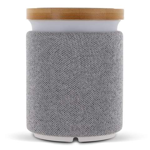 Beautiful and stylish wireless speaker with bamboo inlay. The unique 2-in-1 speaker also functions as a wireless charging station. Charging cable included. Comes packaged in a gift box.