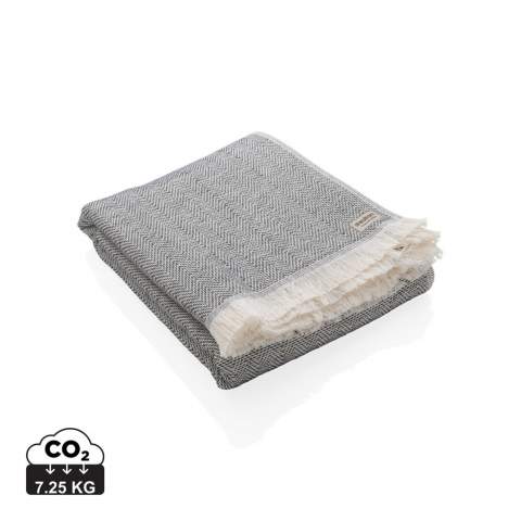 Our most luxurious and versatile towel. The perfect travel companion in any circumstance.  This towel contains 12% recycled cotton and is super soft and silky to the touch. With AWARE™ tracer that validates the genuine use of recycled cotton. You can use it for almost anything, such as the beach, travelling, sauna, swimming pool, camping, sports, as a beach towel, bath towel, scarf, pareo, yoga towel, blanket, as a wrap for your child - you name it. Perfect for sofas and dressing beds, the Hisako throws are also wonderful for sunbathing on or using as a machine-washable picnic blanket. These four seasons hammam towels are quick-drying, mould resistant and incredibly easy to clean making them a brilliant choice for allergy sufferers, red wine lovers and beachgoers.  Each towel saves 1409,2 litres of water. 2% of proceeds of each Impact product sold will be donated to Water.org. Machine washable. Made in Portugal. OEKO-TEX® STANDARD 100. 2306130 Centexbel.