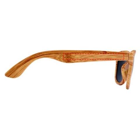 Sunglasses with a retro design and a wooden look finish. These sunglasses with UV 400 lenses are rated as Category 3 making them the perfect choice for protection against bright sunlight. Compliant with EU safety standard EN12312-1. The PC plastic allows the product to be slightly bendable for comfort.