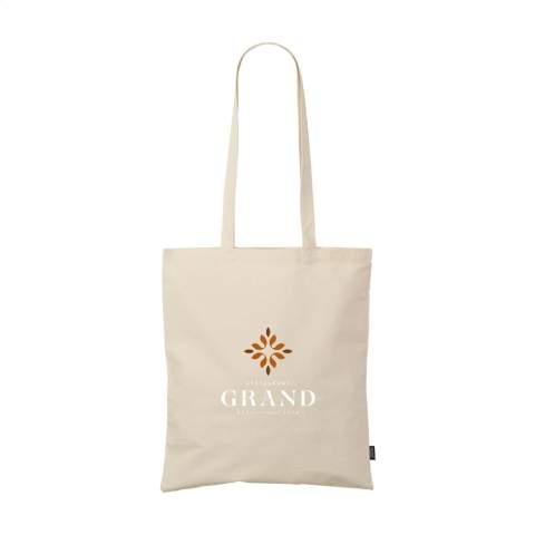 WoW! Winkeltas van 100% vastgeweven gerecycled katoen (140 g/m²). Met lange hengsels. GRS-gecertificeerd. Inhoud ca. 7 liter. Dit katoen is gerecycled. Hierdoor kan de kleur per product variëren.