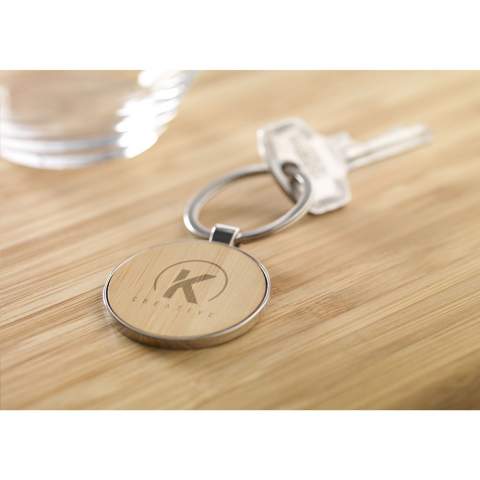 Circular, polished metal and bamboo keyring. A sturdy design made to be a sustainable and responsible product. Each item is supplied in an individual brown cardboard envelope.