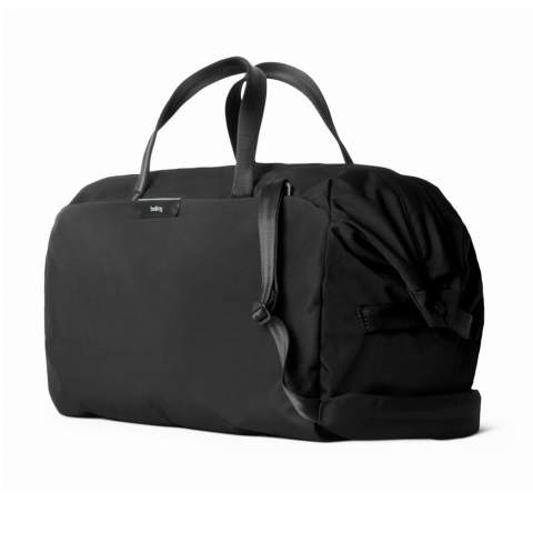 Easy to pack, easy to love. This spacious, uncluttered duffel lets you leave work behind for leisurely weekend adventures. Snap-down ends allow wide-mouth packing. External quick-access pocket with key clip. Internal slip pockets for smaller items. Raised mesh zip pocket for valuables. Strong, rolled-edge webbing handles. Grab loops at each end. Detachable padded shoulder strap.