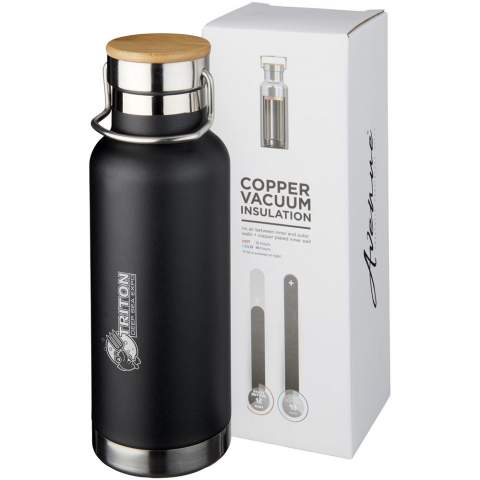 Double-walled stainless steel vacuum construction with copper insulation, which allows beverages to stay cold for 48 hours or hot for at least 12 hours. The construction also prevents condensation on the outside of the bottle. Screw-on lid with wood detail. On-trend, durable powder coating. Volume capacity is 480ml. Presented in an Avenue gift box.