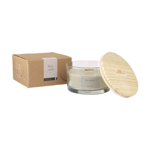 A decorative, luxurious Wooosh scented candle cast in a solid, polished, clear glass jar. This scented candle has a natural wooden wick that crackles, replicating the soothing sound of an open fire. The glass jar is supplied with a pinewood lid that can also be used as a coaster for the candle. The candle is made from 5% eco-friendly soy wax and 95% paraffin wax. As soon as you light the candle, your room will fill with the mysterious scent of Fine Oudh, producing a sweet, smoky and woody aroma. Oudh is a fascinating and precious type of wood. In Arabic and Japanese culture, Oudh has a special spiritual status in many rituals. This scent is associated with seduction but also with comfort and protection. This elegant scented candle has approximately 35 burning hours and will make an attractive and decorative addition to any home. Each item is supplied in a luxurious Wooosh gift box.