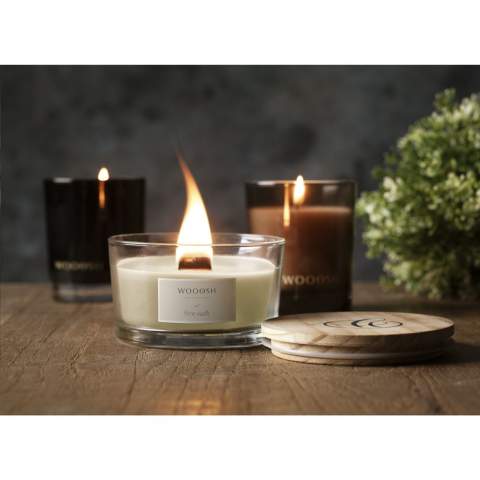 A decorative, luxurious Wooosh scented candle cast in a solid, polished, clear glass jar. This scented candle has a natural wooden wick that crackles, replicating the soothing sound of an open fire. The glass jar is supplied with a pinewood lid that can also be used as a coaster for the candle. The candle is made from 5% eco-friendly soy wax and 95% paraffin wax. As soon as you light the candle, your room will fill with the mysterious scent of Fine Oudh, producing a sweet, smoky and woody aroma. Oudh is a fascinating and precious type of wood. In Arabic and Japanese culture, Oudh has a special spiritual status in many rituals. This scent is associated with seduction but also with comfort and protection. This elegant scented candle has approximately 35 burning hours and will make an attractive and decorative addition to any home. Each item is supplied in a luxurious Wooosh gift box.