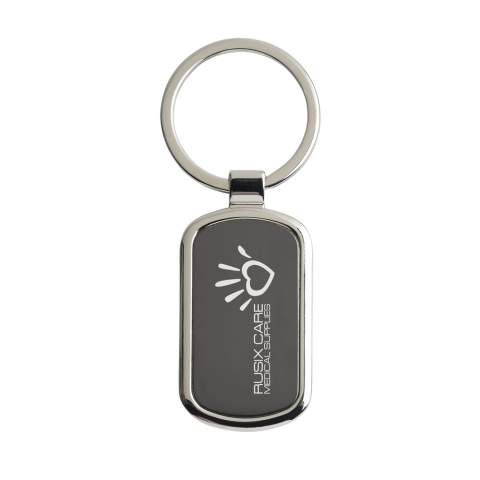 A rectangular, polished, nickel metal keyring with black inlay and sturdy keyring. Each item is supplied in an individual brown cardboard envelope.