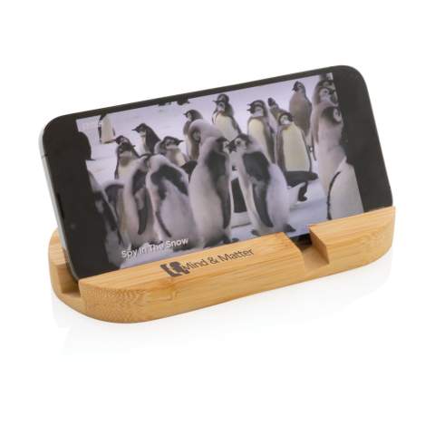 Phone stand made from completely natural bamboo. Perfect on your desk or when you are working from home. The stand can hold most mobile devices and tablets.  The shorter groove is optimized for mobile phones and the longer one for tablets.