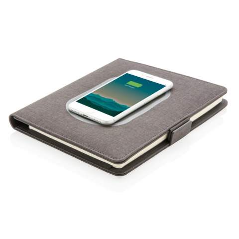 This notebook cover with removable notebook (128 lined pages of 80 gsm) boasts the latest technology. The front cover has a wireless charging pad for your phone. (Android latest generations, iPhone 8 and up). Older phones and tablets can be charged via the USB ports from the 4.000 mAh powerbank. The unique USB ports pop up with a simple click of a button.  Input: 5.0V/1.0A. Output: 5.0V/2.1A. Wireless Output: 5W. Registered design®<br /><br />NotebookFormat: A5<br />WirelessCharging: true<br />PowerbankCapacity: 4000<br />NumberOfPages: 128<br />PaperRulingLayout: Lined pages