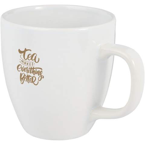 The Moni ceramic mug has a trendy glossy finish adding a sleek touch. It features a large handle that provides a comfortable and sturdy grip. The mug is versatile enough to use with both hot and cold beverages allowing you to enjoy coffee, tea, soup, and more.  Volume capacity is 430 ml. Dishwasher safe for all printing methods. Presented in a recycled cardboard gift box.